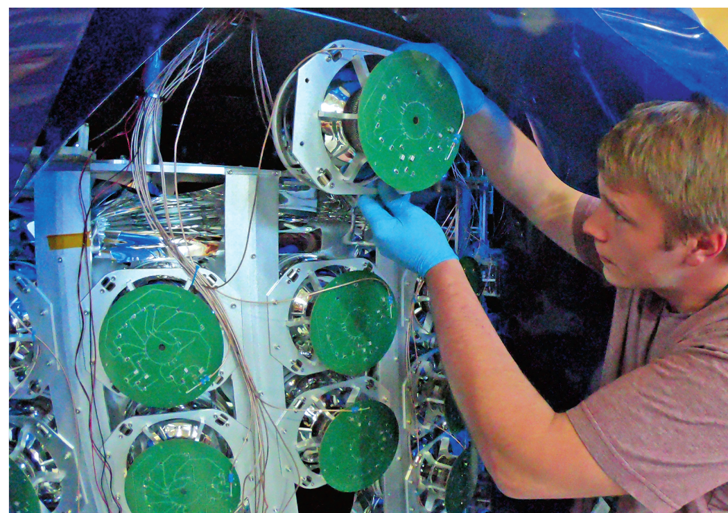T. J. Schaub working inside the CCM detector