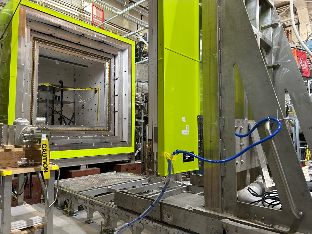 Large magnetic shield room door and extended track at the LANL nEDM experiment